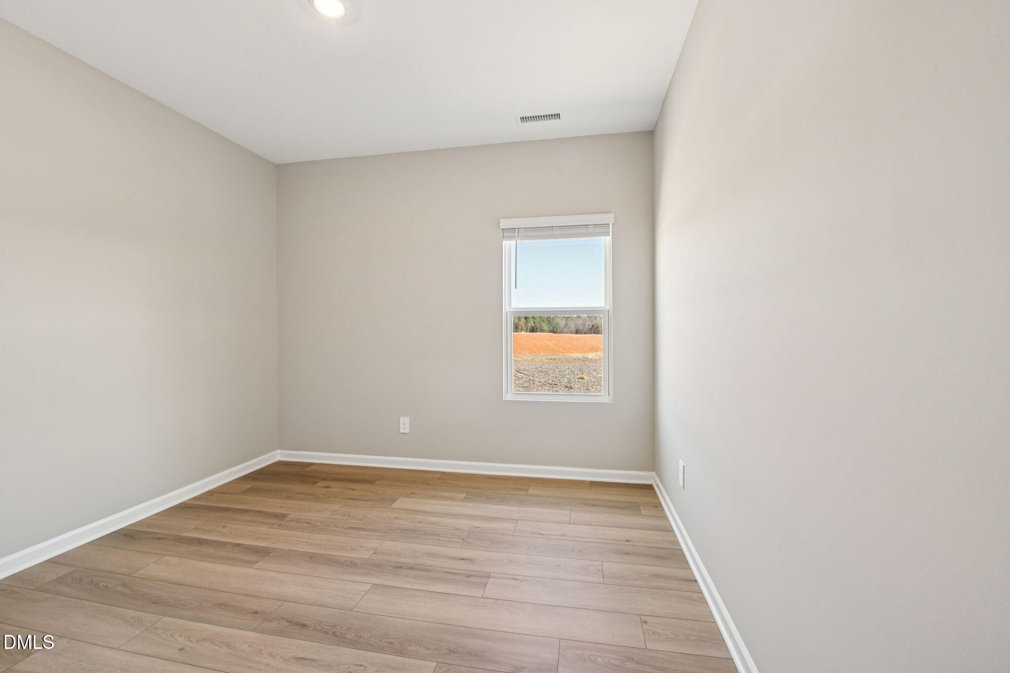 3516 Telluride Trail Raleigh, NC 27616 - Photo 19 of 47 an empty room with wooden floor and windows