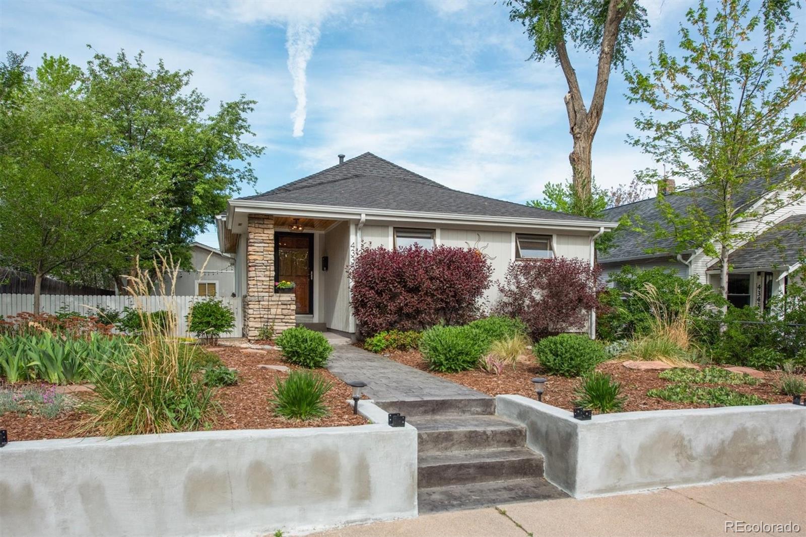 front view of a house with a yard
