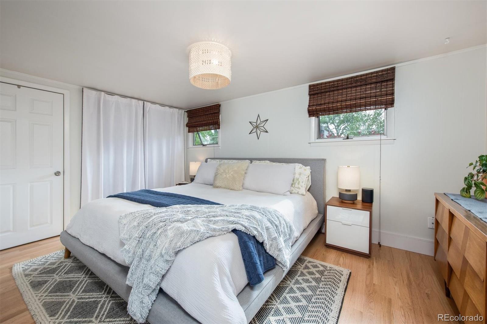 4335 Zenobia Street Denver, CO 80212 - Photo 11 of 26 a bedroom with a large bed and a window