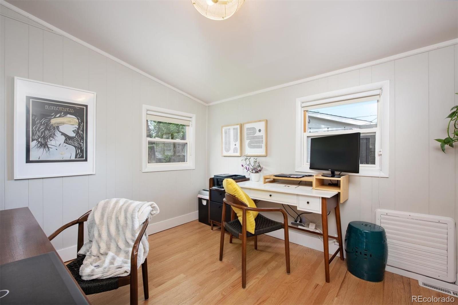 4335 Zenobia Street Denver, CO 80212 - Photo 13 of 26 a view of a workspace with furniture window and wooden floor