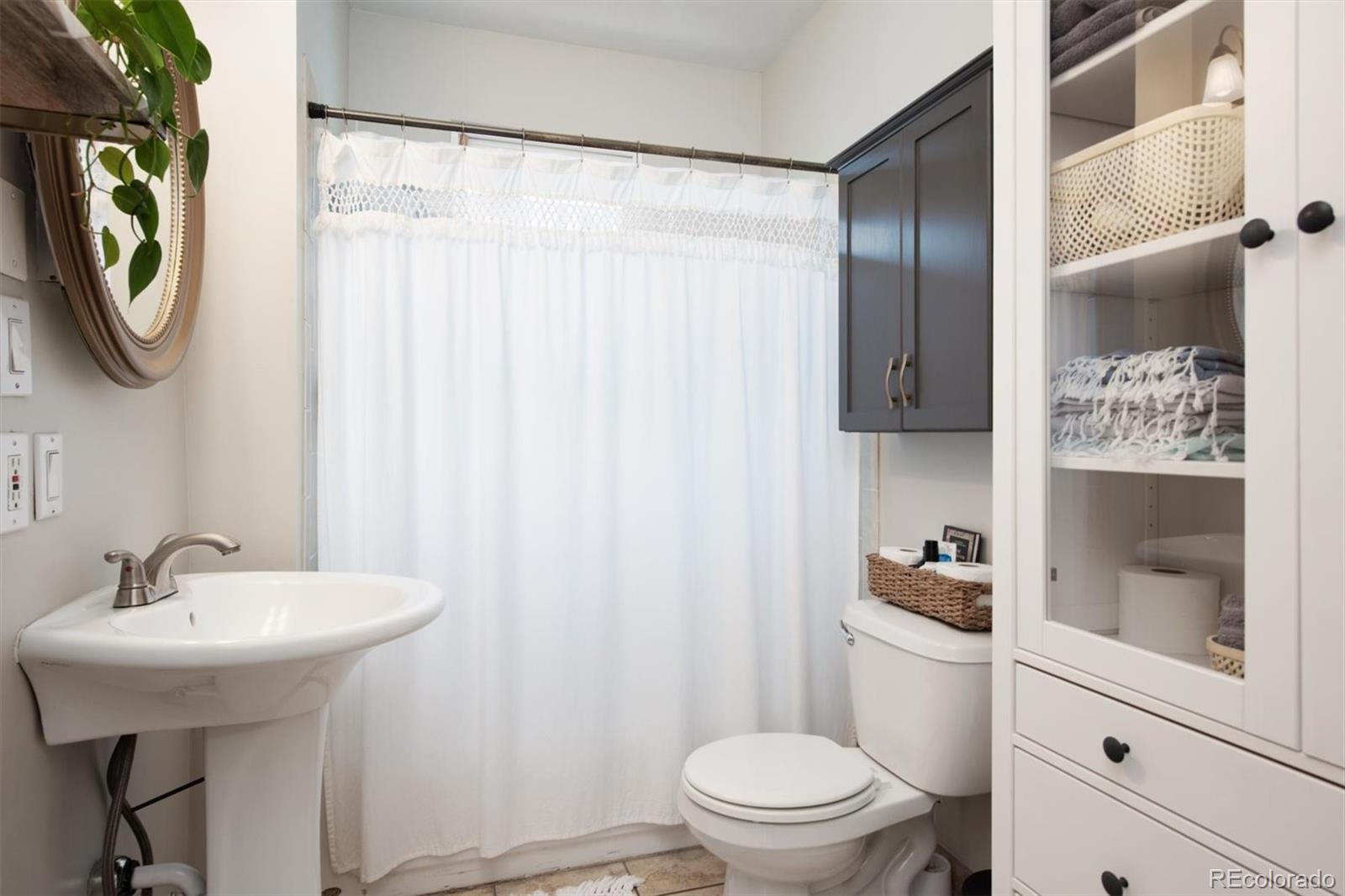 4335 Zenobia Street Denver, CO 80212 - Photo 14 of 26 a bathroom with a sink toilet and shower