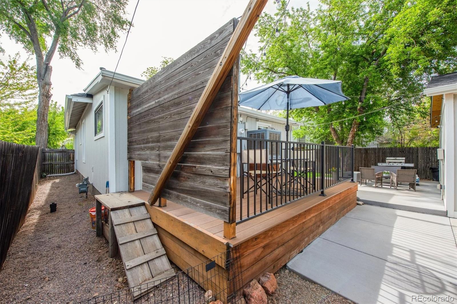 4335 Zenobia Street Denver, CO 80212 - Photo 17 of 26 a view of backyard with deck and outdoor seating