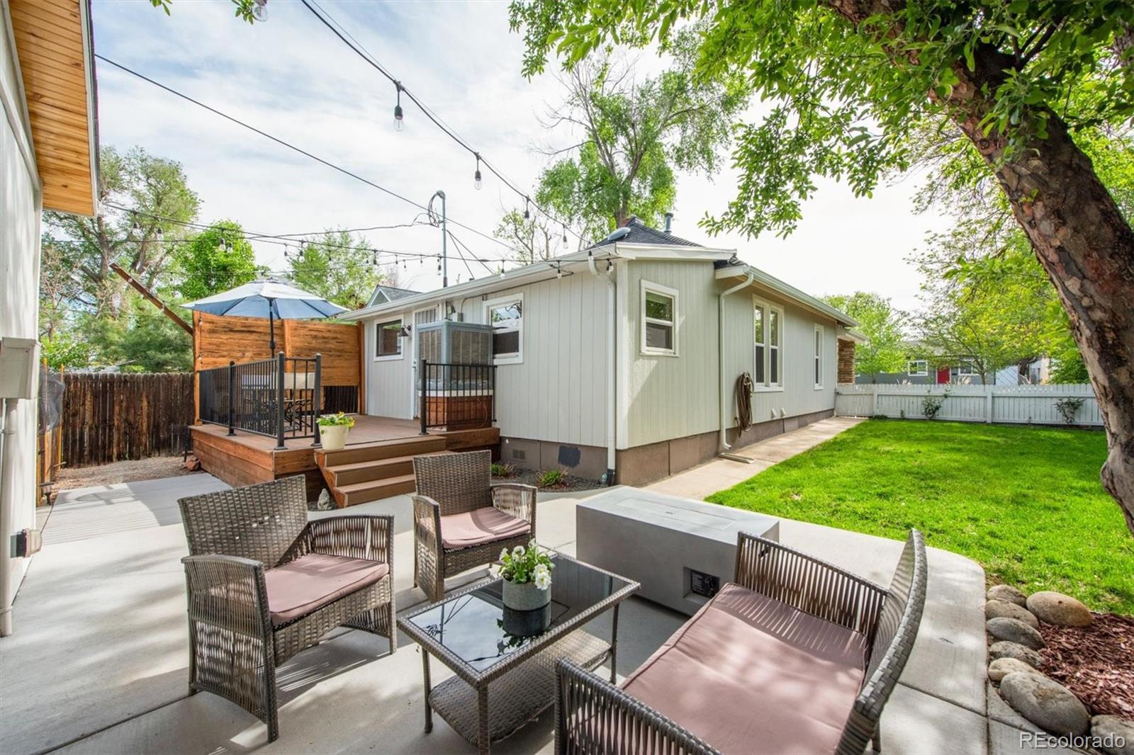 4335 Zenobia Street Denver, CO 80212 - Photo 19 of 26 a view of a patio with a table and chairs under an umbrella