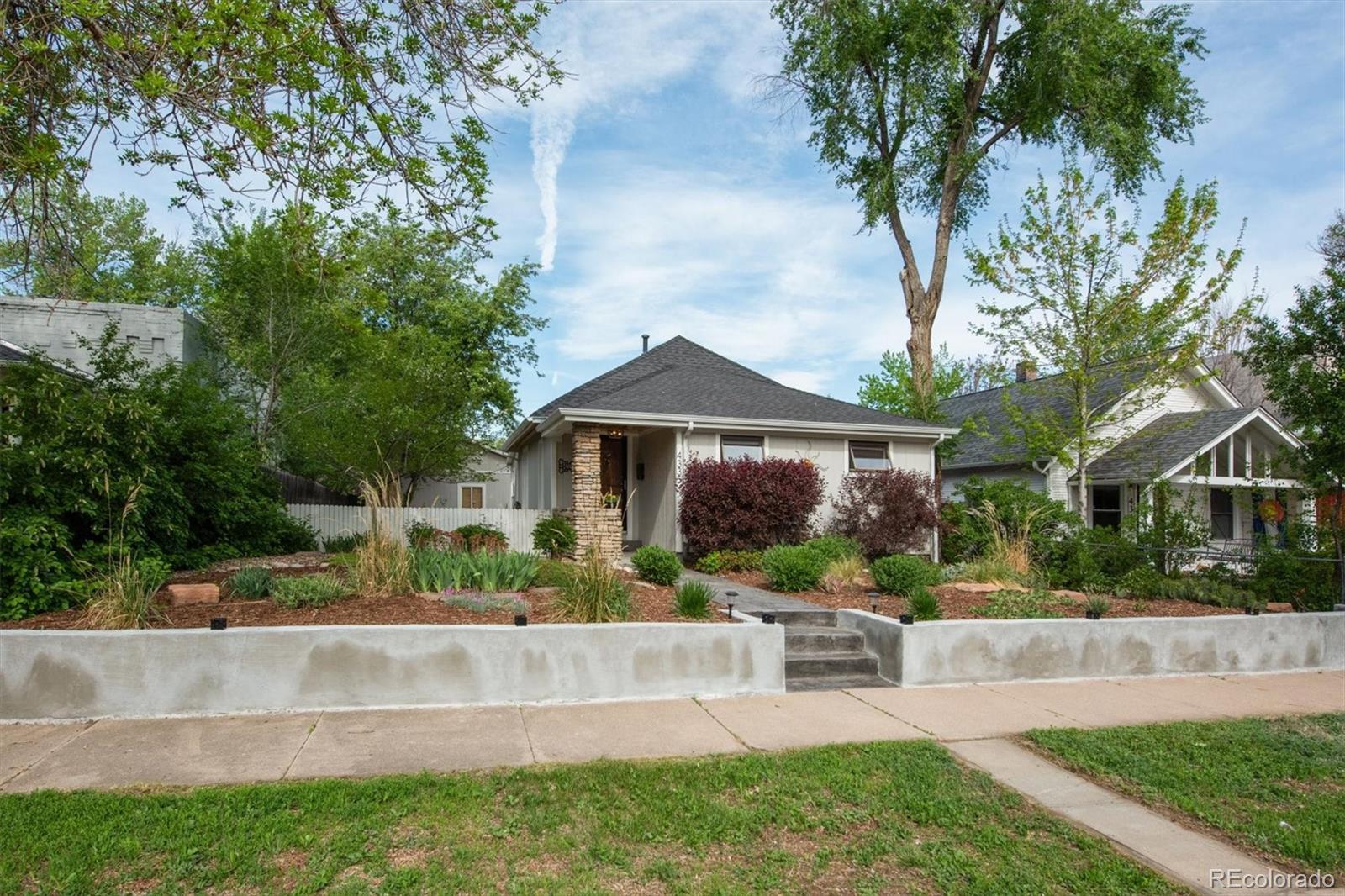 4335 Zenobia Street Denver, CO 80212 - Photo 23 of 26 a front view of a house with a yard