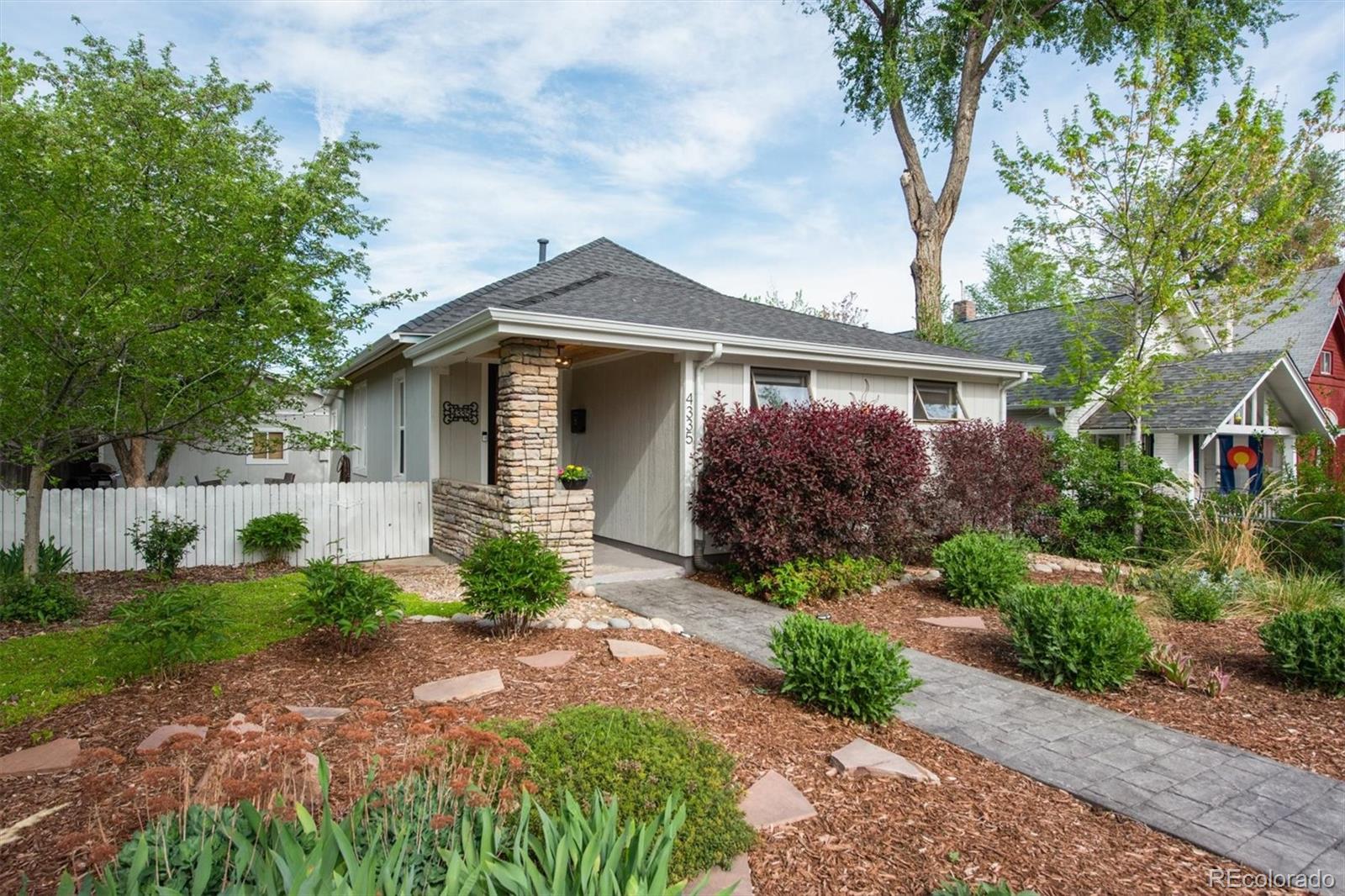 4335 Zenobia Street Denver, CO 80212 - Photo 26 of 26 a front view of a house with garden