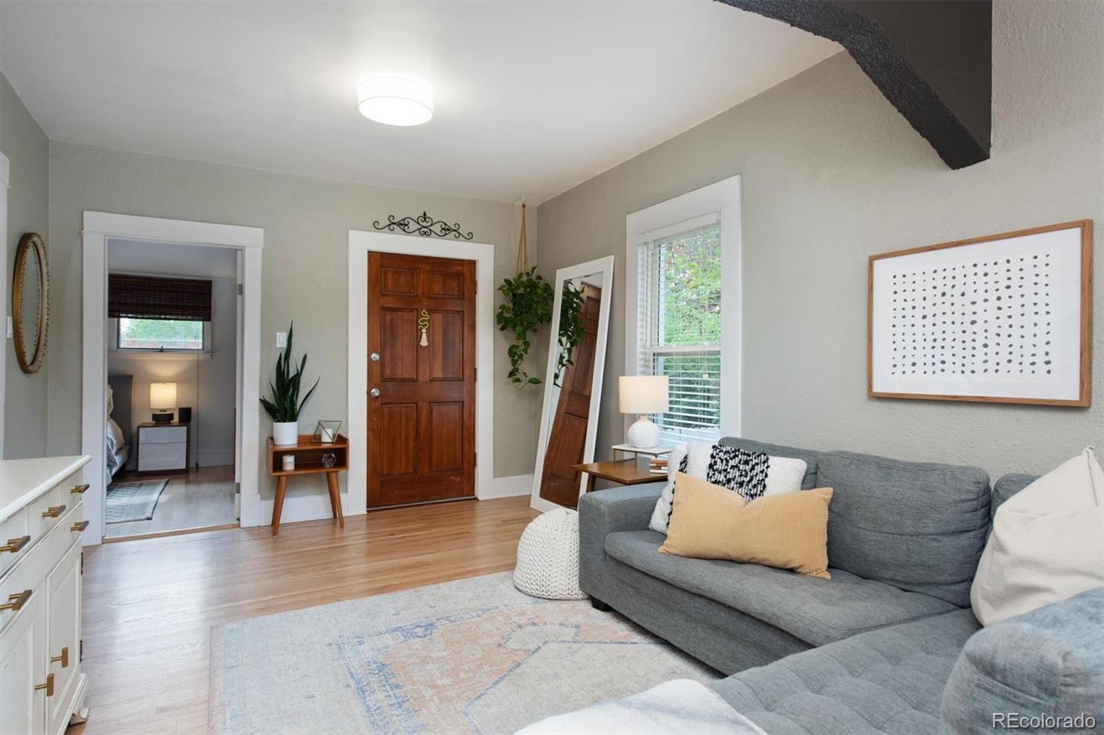 4335 Zenobia Street Denver, CO 80212 - Photo 3 of 26 a living room with furniture and a window