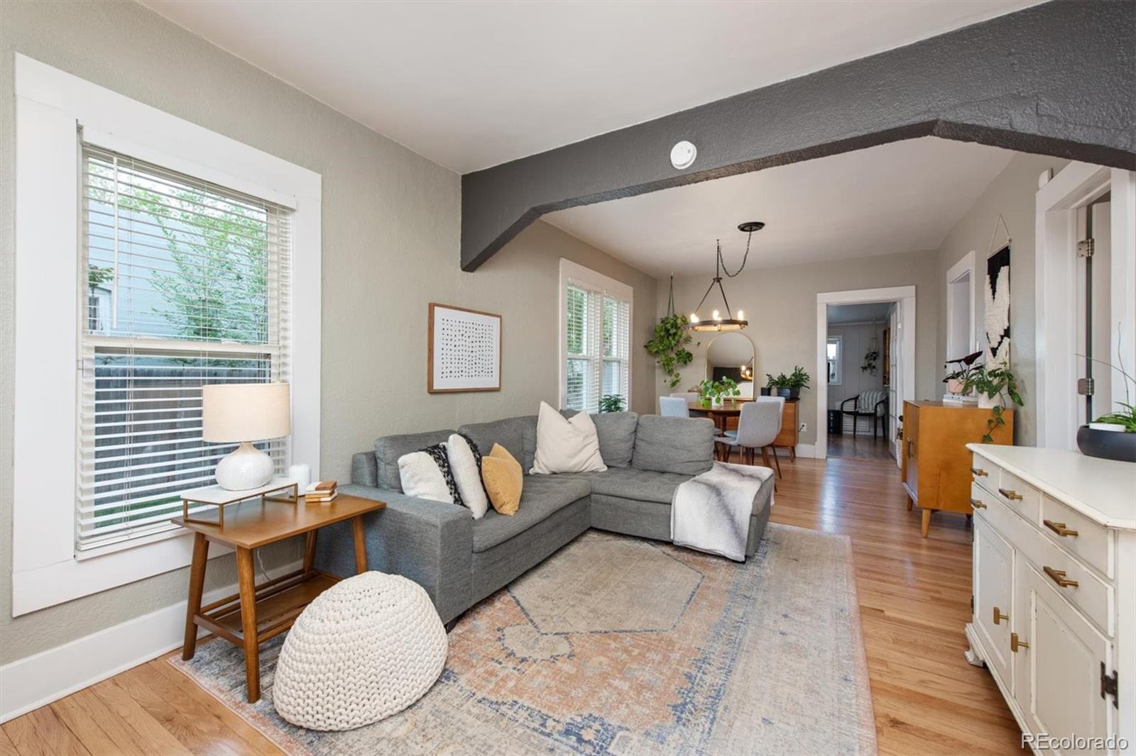 4335 Zenobia Street Denver, CO 80212 - Photo 4 of 26 a living room with fireplace furniture and a potted plant