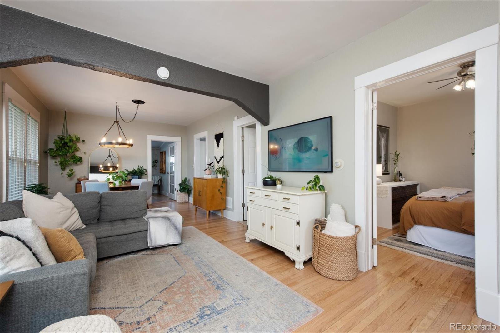 4335 Zenobia Street Denver, CO 80212 - Photo 5 of 26 a living room with furniture and a flat screen tv