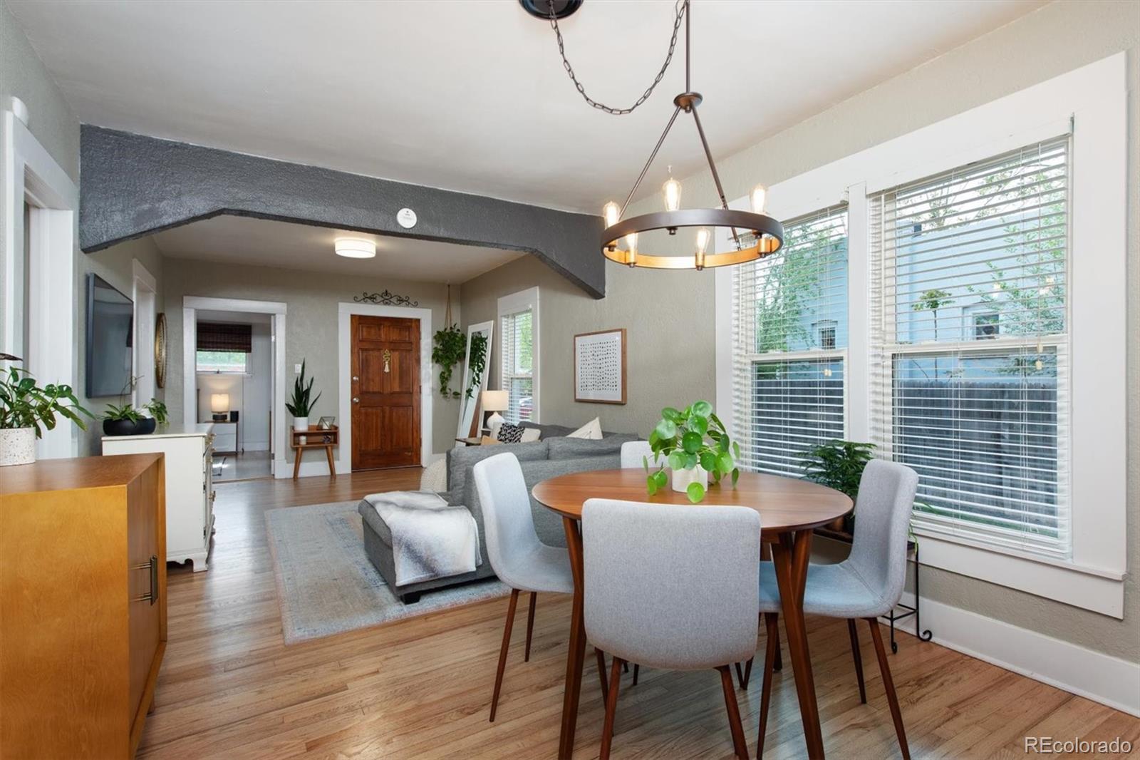4335 Zenobia Street Denver, CO 80212 - Photo 6 of 26 a view of a dining room with furniture window and wooden floor