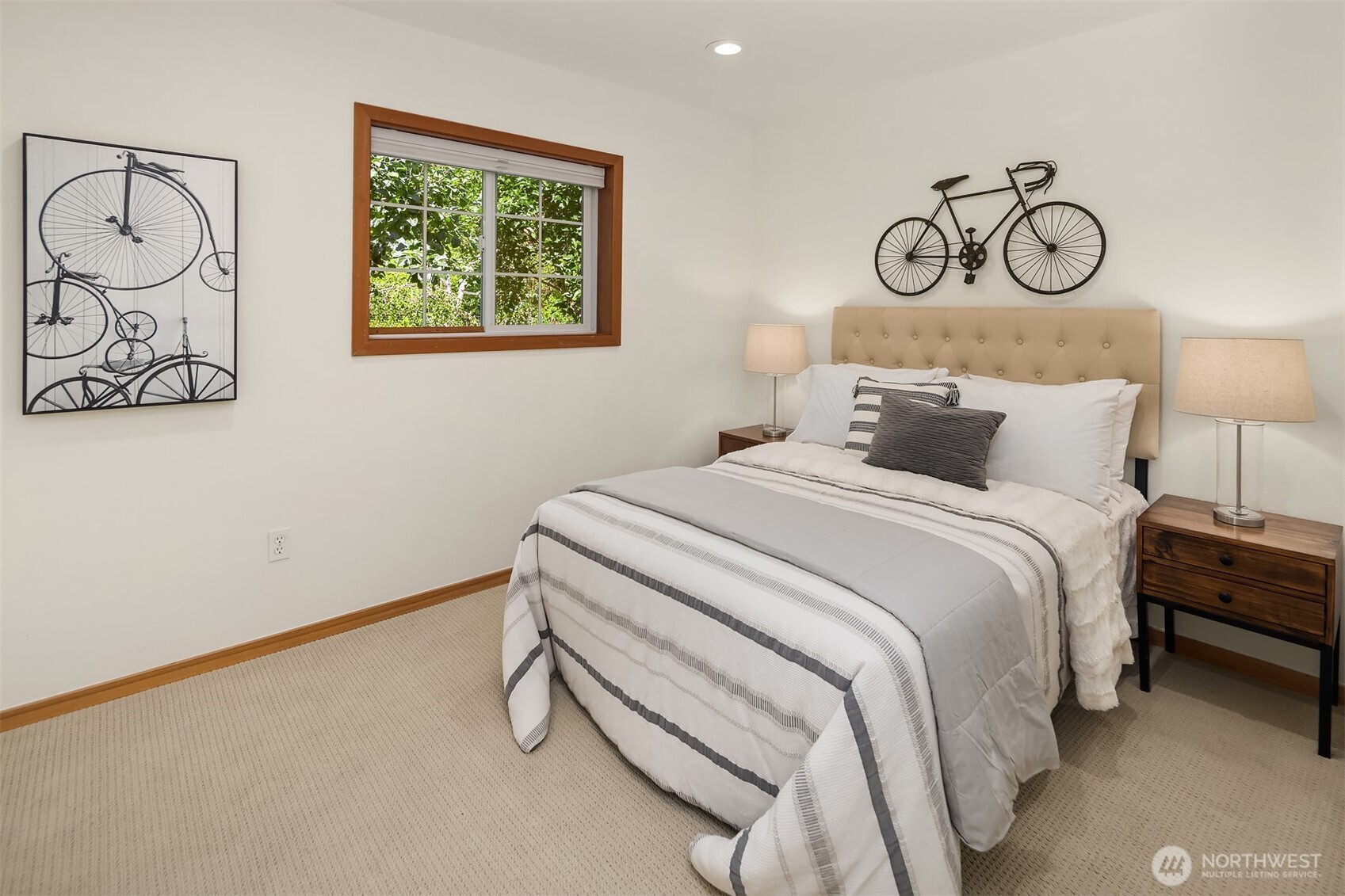 537 30th Avenue East Seattle, WA 98112 - Photo 17 of 25 a bedroom with a bed and cabinets