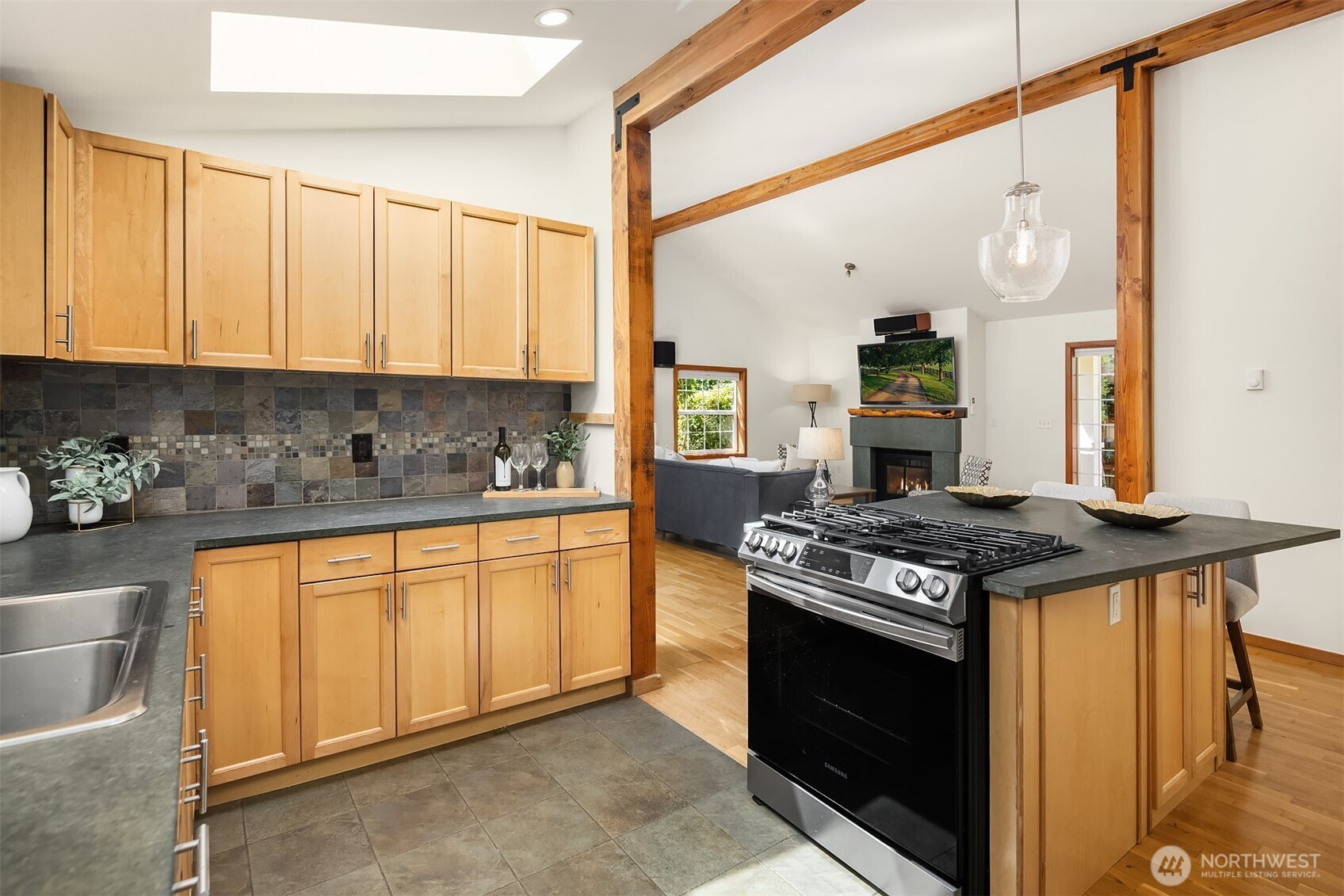537 30th Avenue East Seattle, WA 98112 - Photo 9 of 25 a kitchen with stainless steel appliances granite countertop a stove a sink and a refrigerator