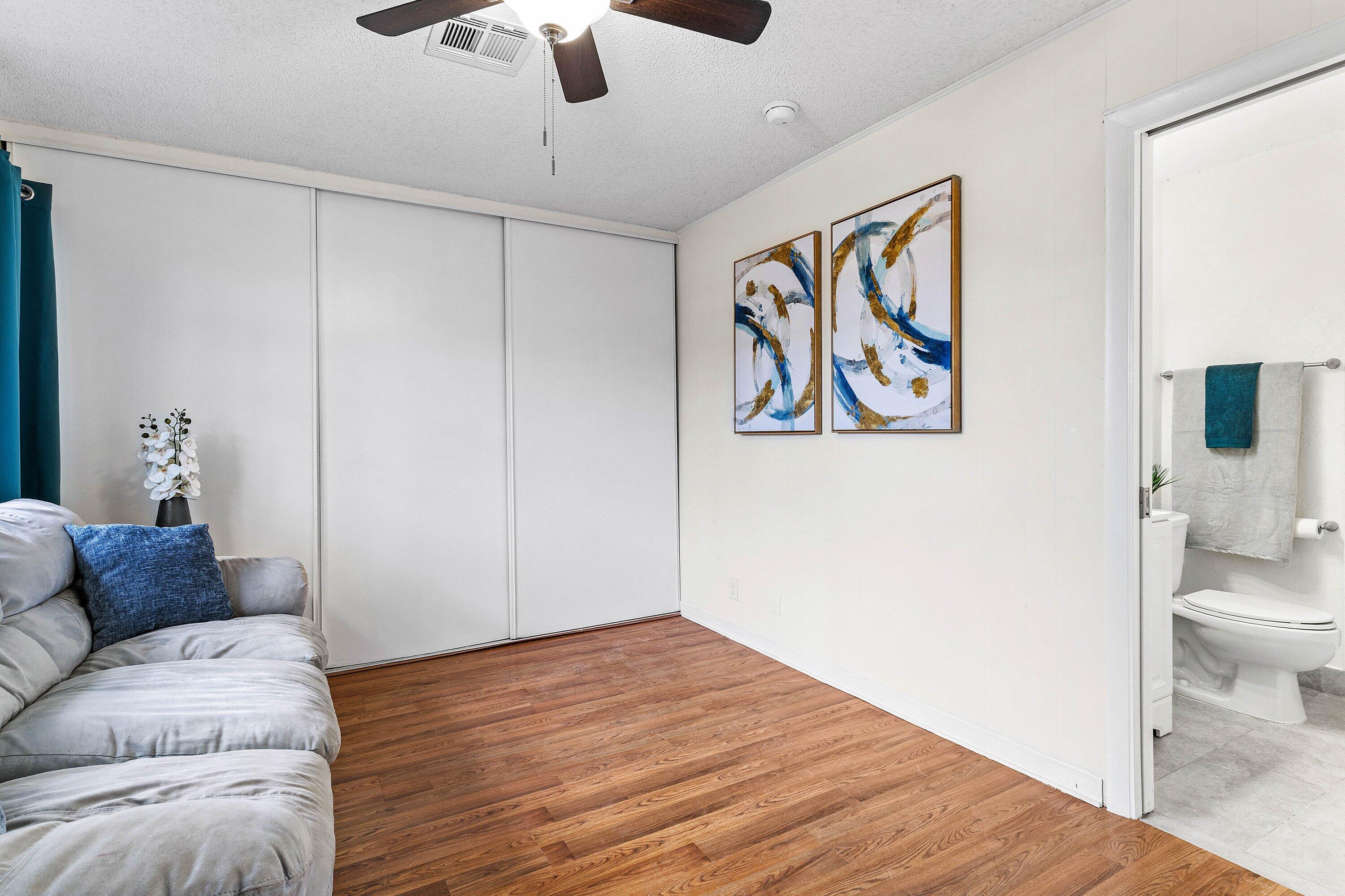 13899 Via Aurora, Unit C Delray Beach, FL 33484 - Photo 13 of 39 a living room with furniture and a rug