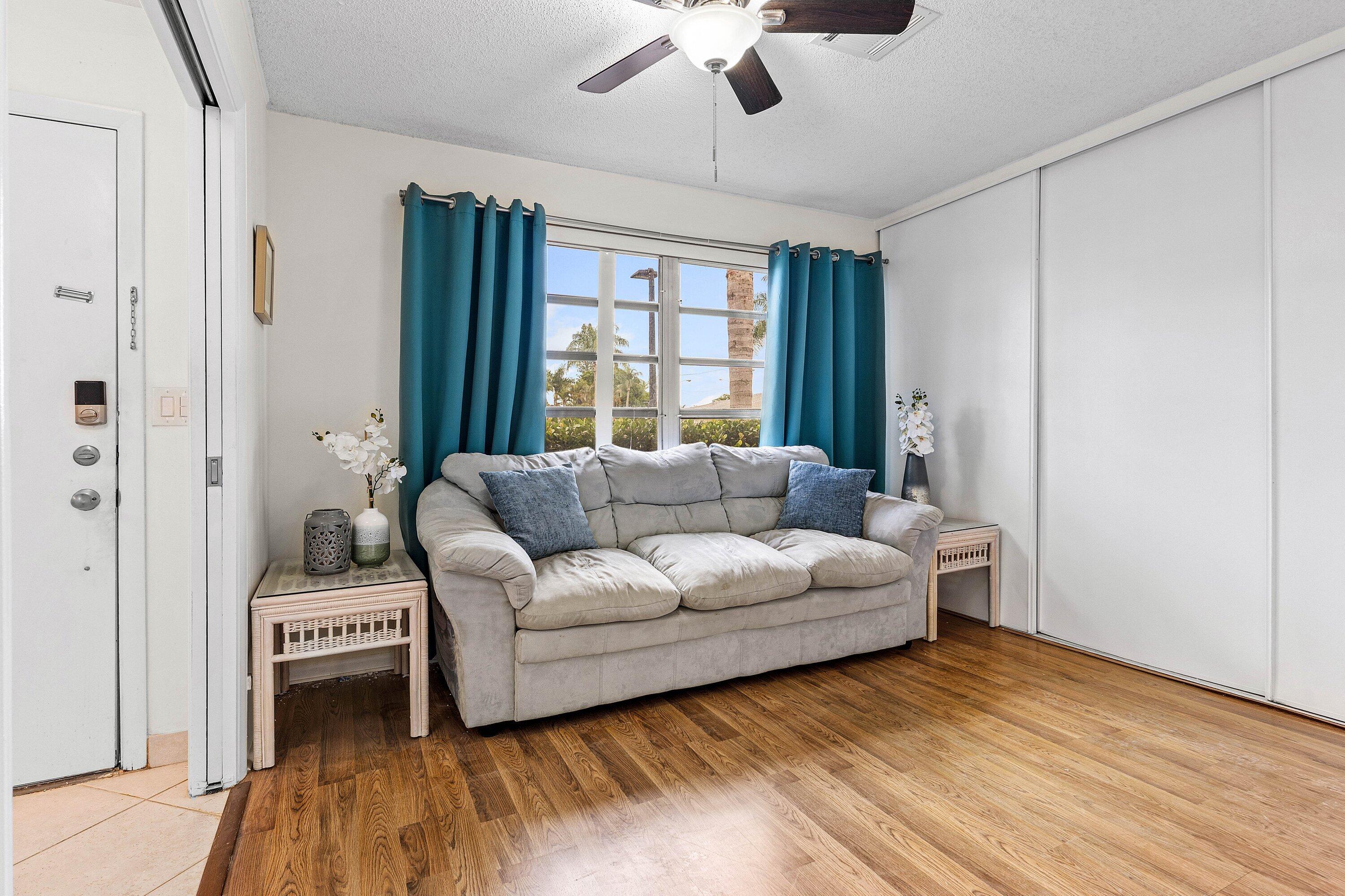 13899 Via Aurora, Unit C Delray Beach, FL 33484 - Photo 14 of 39 a living room with furniture and a window