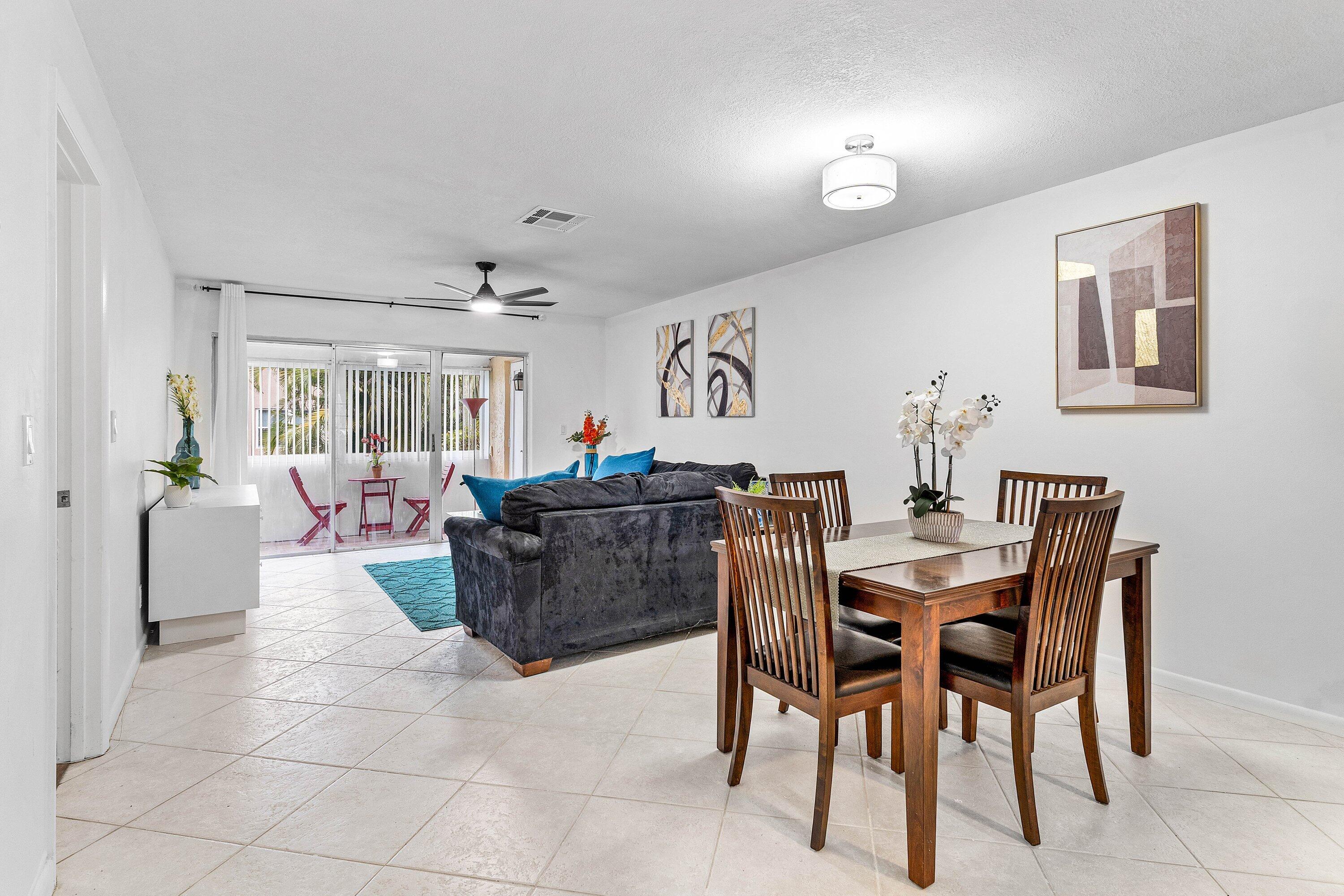 13899 Via Aurora, Unit C Delray Beach, FL 33484 - Photo 19 of 39 a view of a dining room with furniture