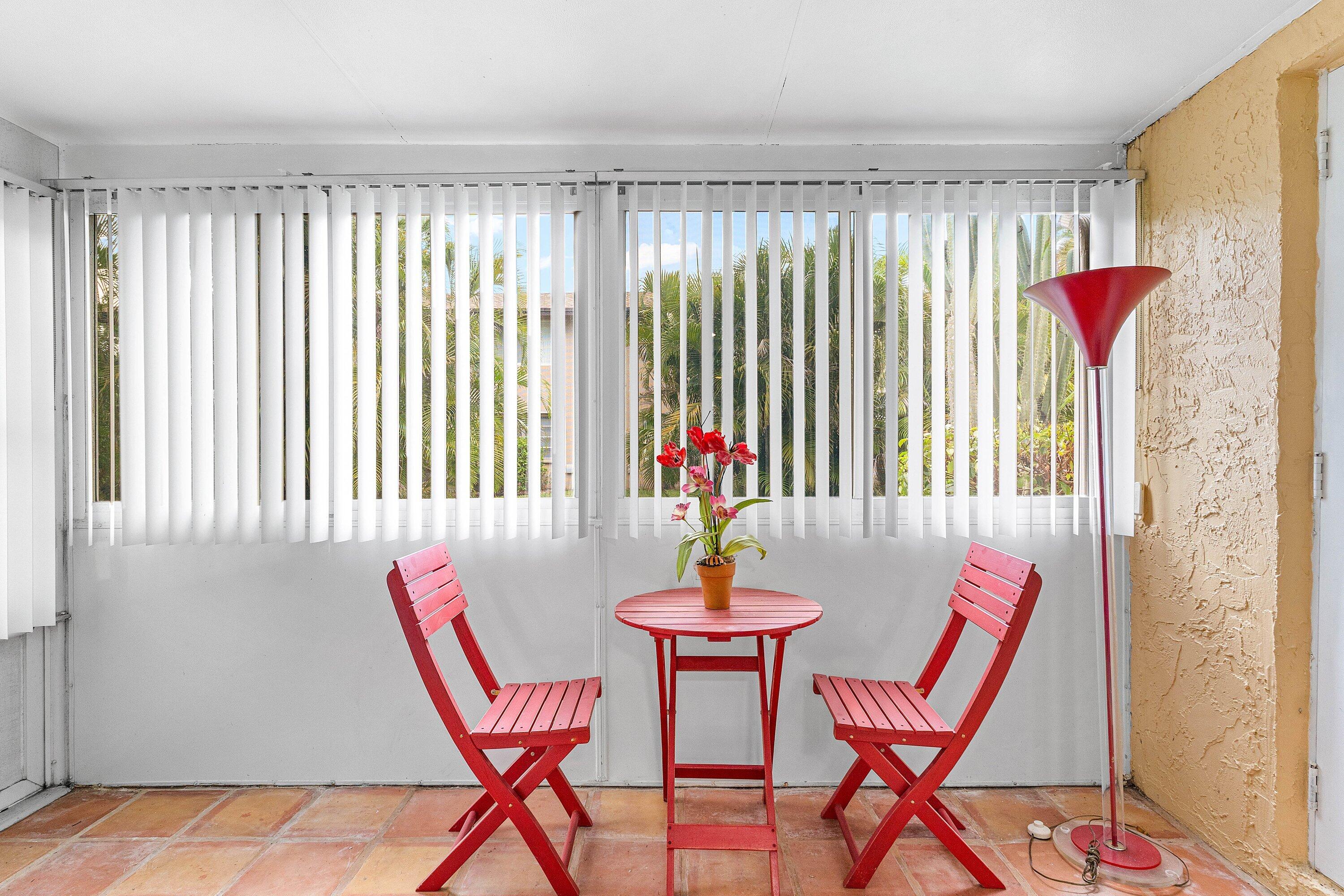 13899 Via Aurora, Unit C Delray Beach, FL 33484 - Photo 29 of 39 a view of a dining room with furniture and a window