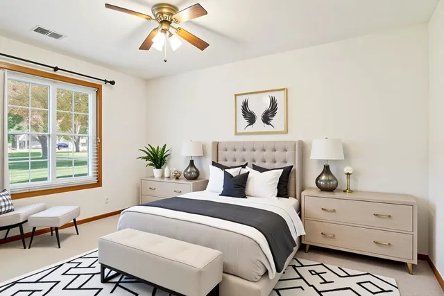 a bedroom with a bed and a window