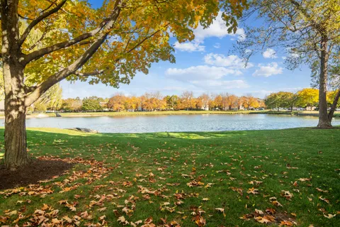 a view of a lake with houses in the back