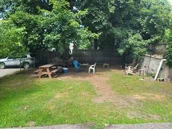 230 Corey Road Boston, MA 02135 - Photo 12 of 13 a view of a park with swings and slides