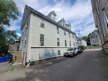 230 Corey Road Boston, MA 02135 - Photo 4 of 13 a view of a house with a street