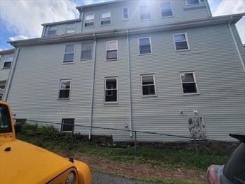 230 Corey Road Boston, MA 02135 - Photo 7 of 13 a view of a house with backyard and sitting area