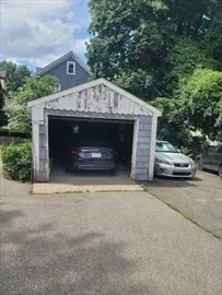 a view of street with parked cars