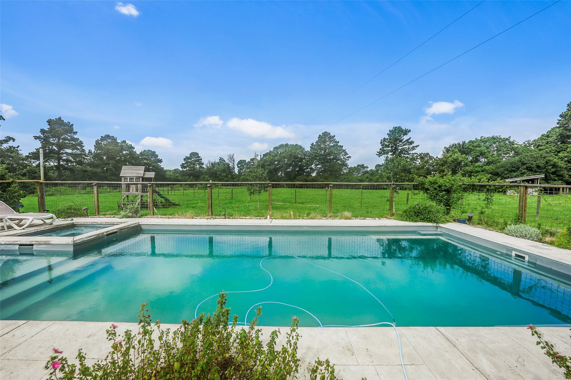 26534 Mitchell Road Hempstead, TX 77445 - Photo 36 of 45 a view of a swimming pool with a yard