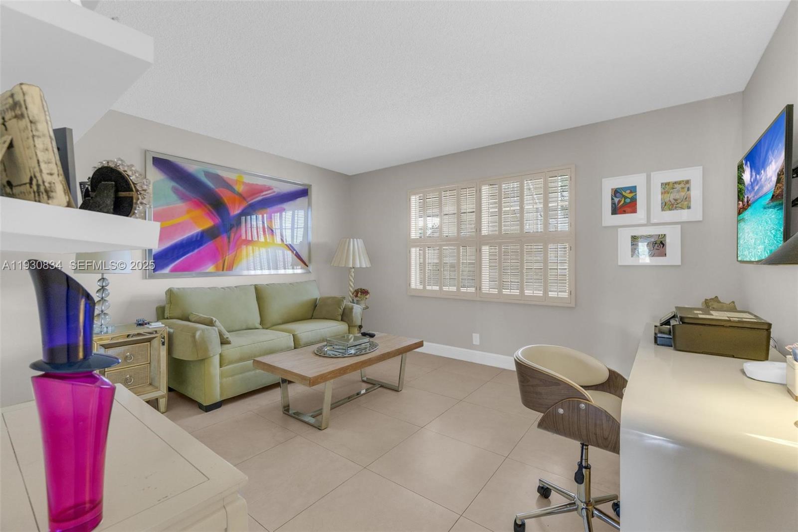 4402 Martinique Court, Unit K2 Coconut Creek, FL 33066 - Photo 24 of 38 a living room with furniture and a window