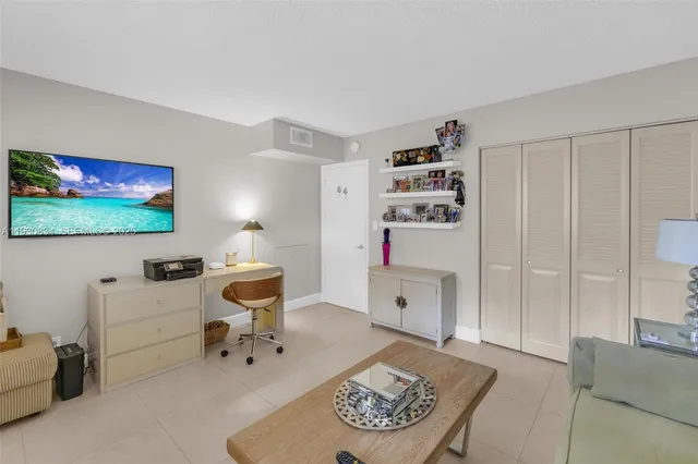 a room with furniture and a flat screen tv