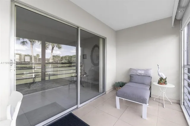 a room with furniture and a potted plant