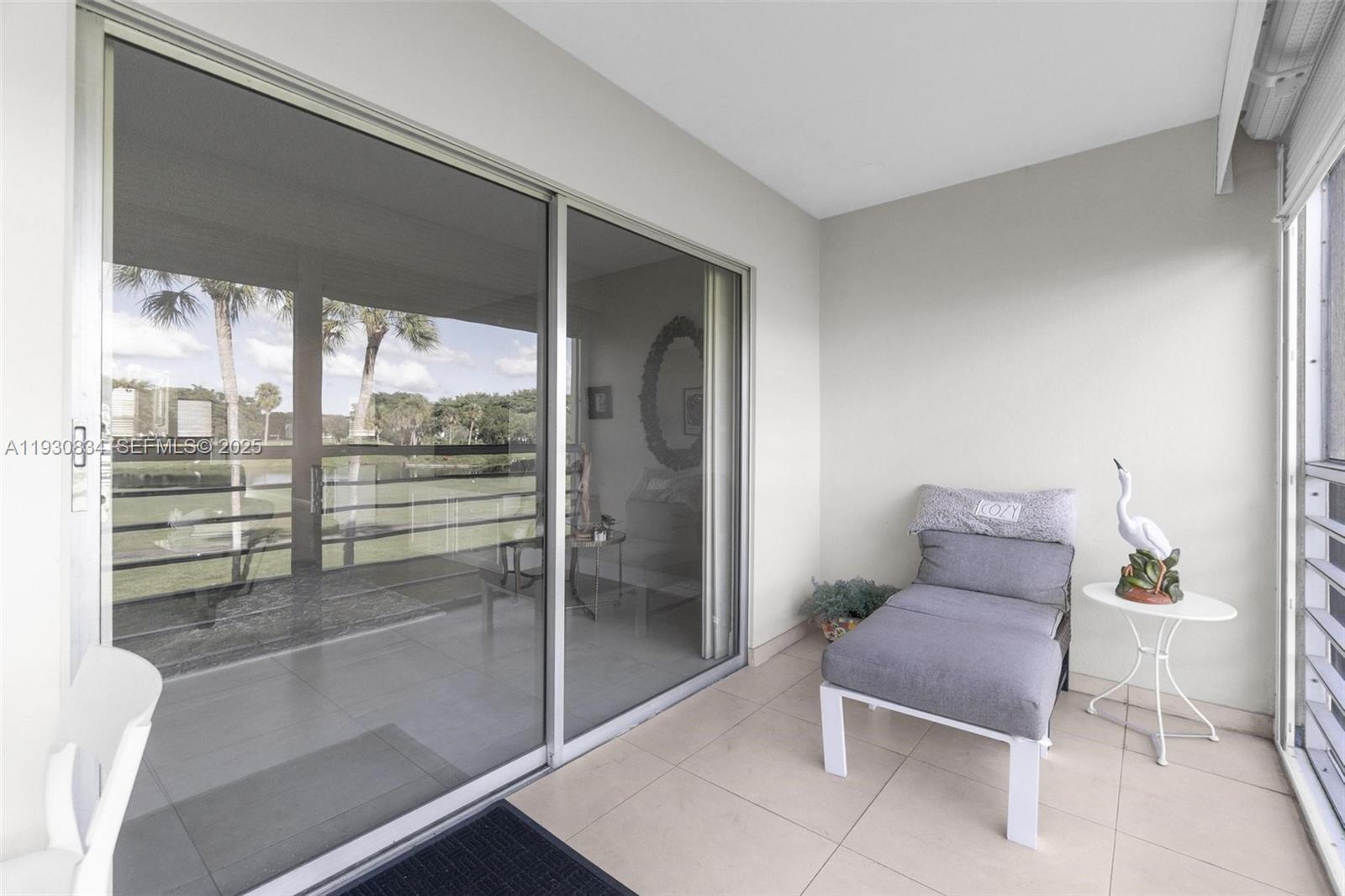 4402 Martinique Court, Unit K2 Coconut Creek, FL 33066 - Photo 30 of 38 a room with furniture and a potted plant