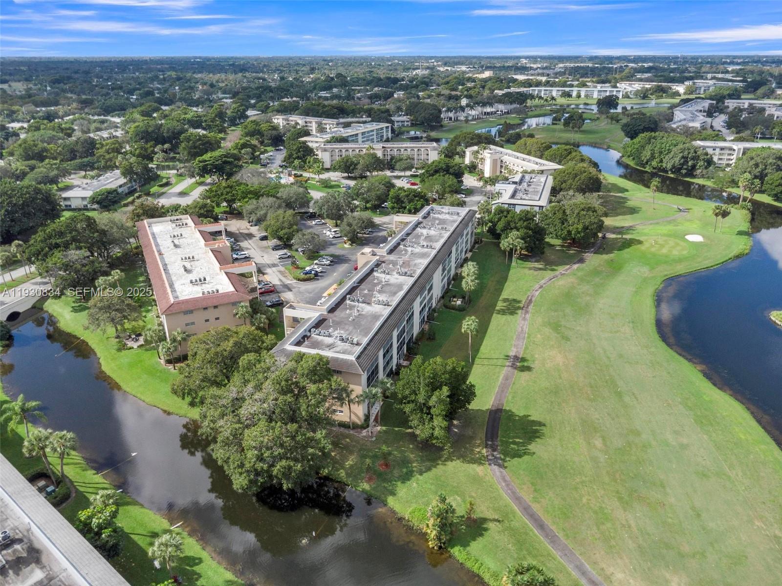 4402 Martinique Court, Unit K2 Coconut Creek, FL 33066 - Photo 35 of 38 an aerial view of residential houses with outdoor space