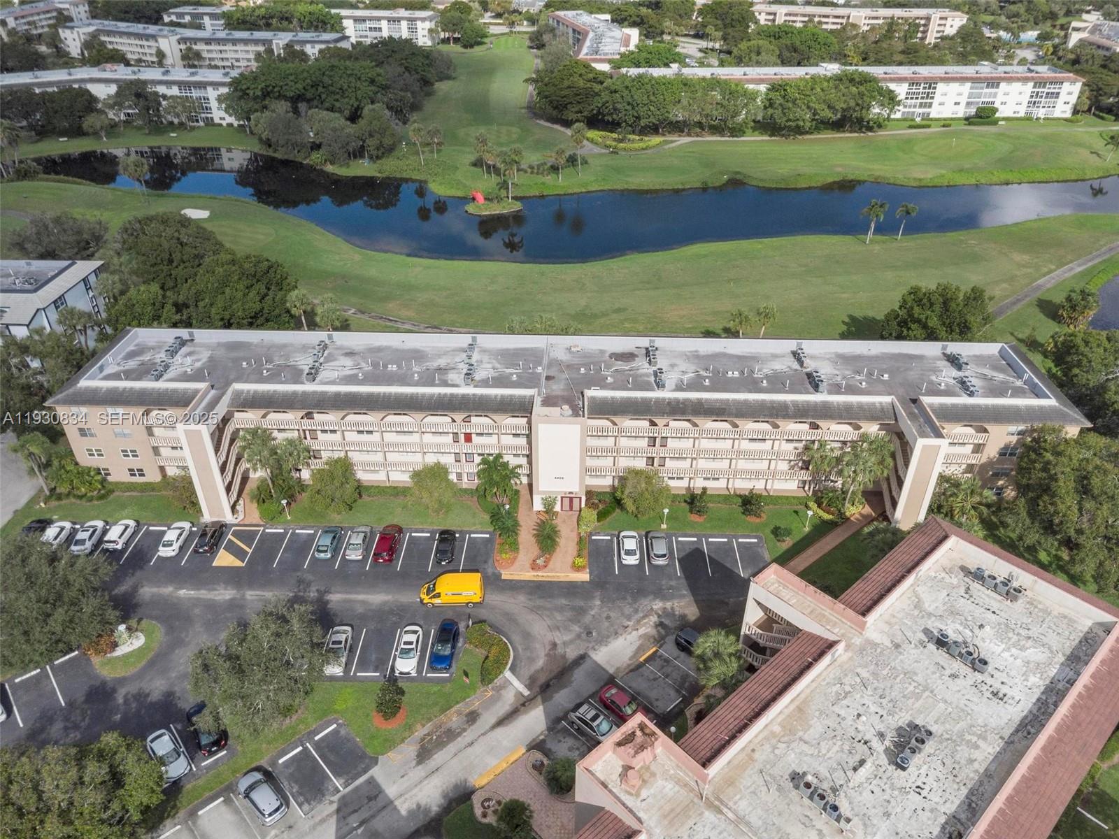 4402 Martinique Court, Unit K2 Coconut Creek, FL 33066 - Photo 36 of 38 an aerial view of a house with a garden
