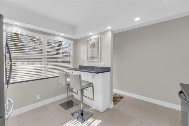 a workspace with furniture and a window