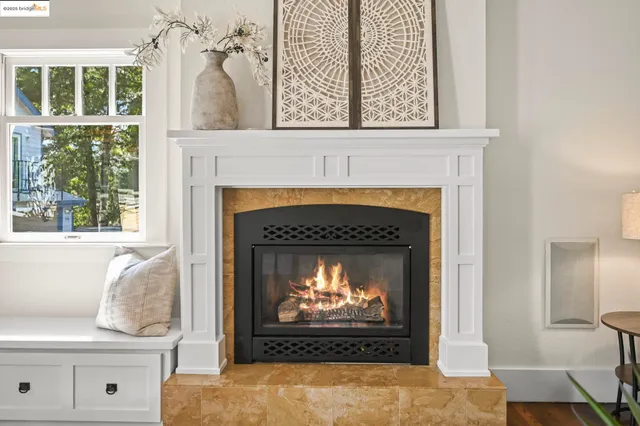 a living room with a fireplace and a fireplace