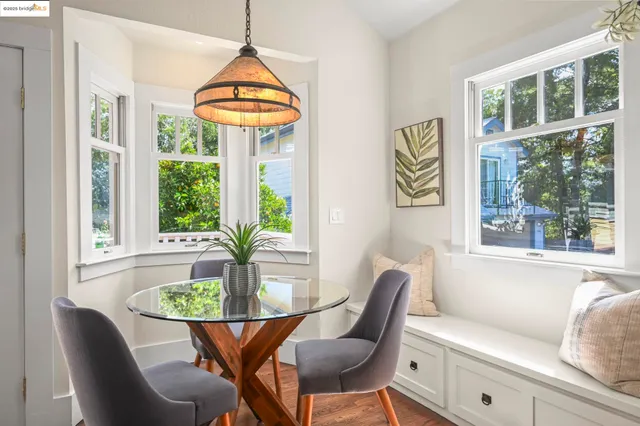 a dining room with furniture and window