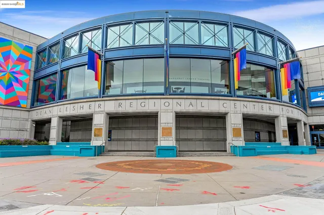 a front view of building with a garden