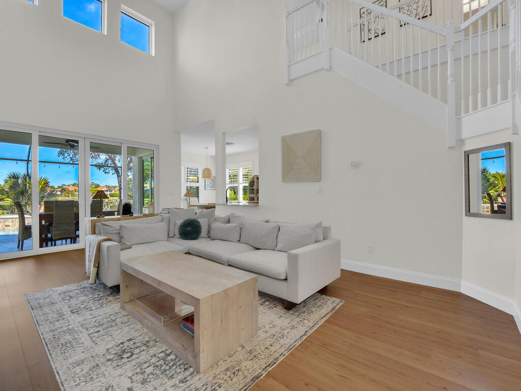 7851 Founders Circle Naples, FL 34104 - Photo 12 of 43 a living room with fireplace furniture and a rug