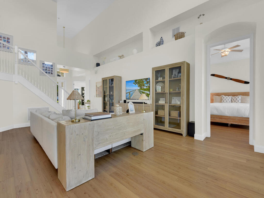 7851 Founders Circle Naples, FL 34104 - Photo 15 of 43 a view of living room kitchen with furniture and wooden floor