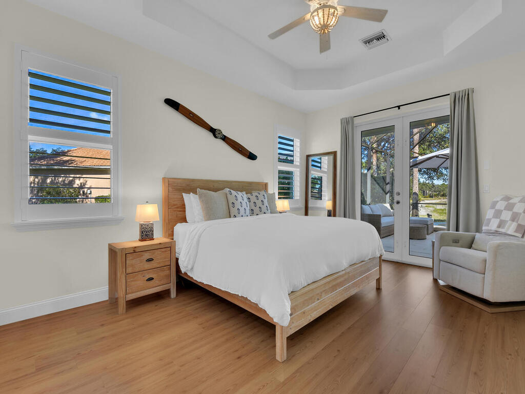 7851 Founders Circle Naples, FL 34104 - Photo 17 of 43 a bed room with a bed and a couch