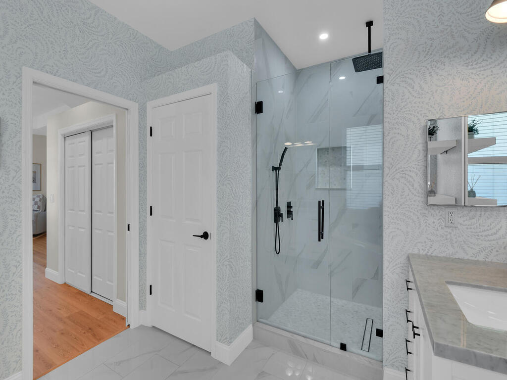 7851 Founders Circle Naples, FL 34104 - Photo 21 of 43 a bathroom with a shower