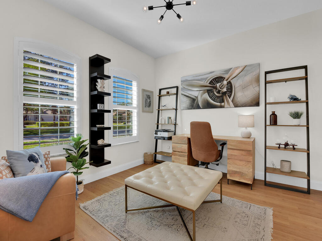 7851 Founders Circle Naples, FL 34104 - Photo 22 of 43 a living room with furniture and window