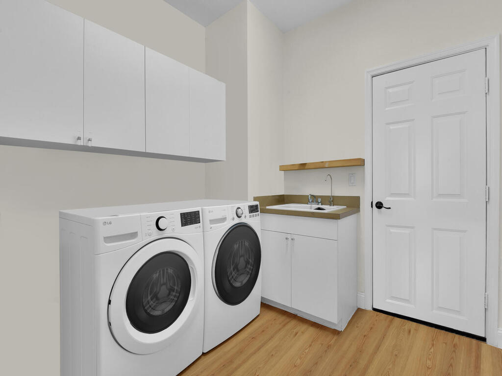 7851 Founders Circle Naples, FL 34104 - Photo 24 of 43 a utility room with dryer and washer