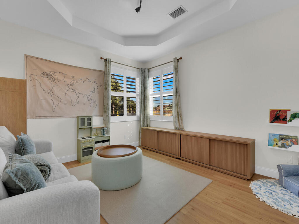 7851 Founders Circle Naples, FL 34104 - Photo 28 of 43 a living room with furniture and a window