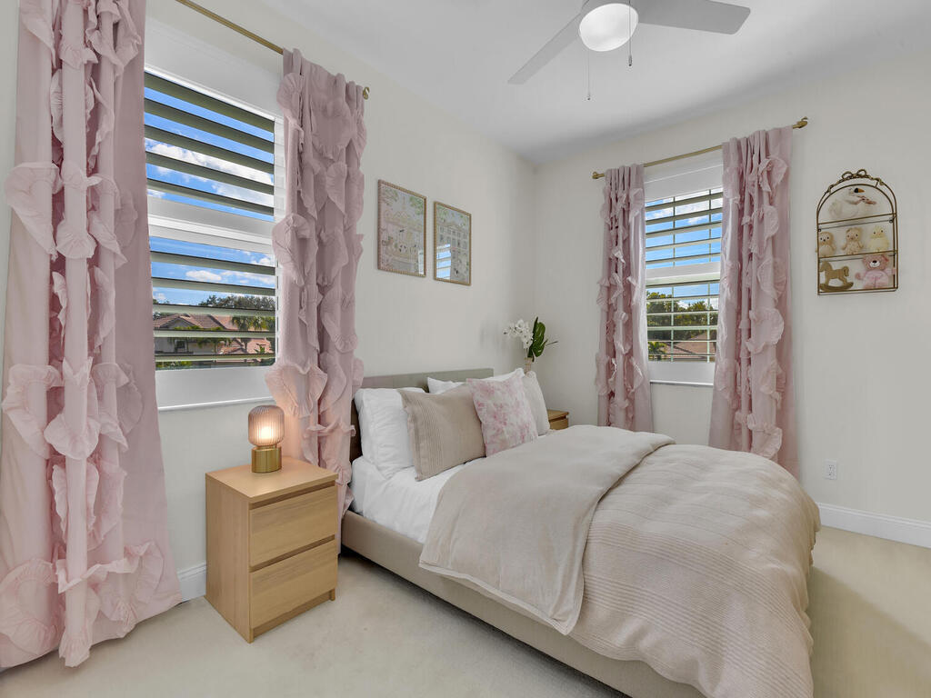 7851 Founders Circle Naples, FL 34104 - Photo 32 of 43 a bedroom with a bed and a window