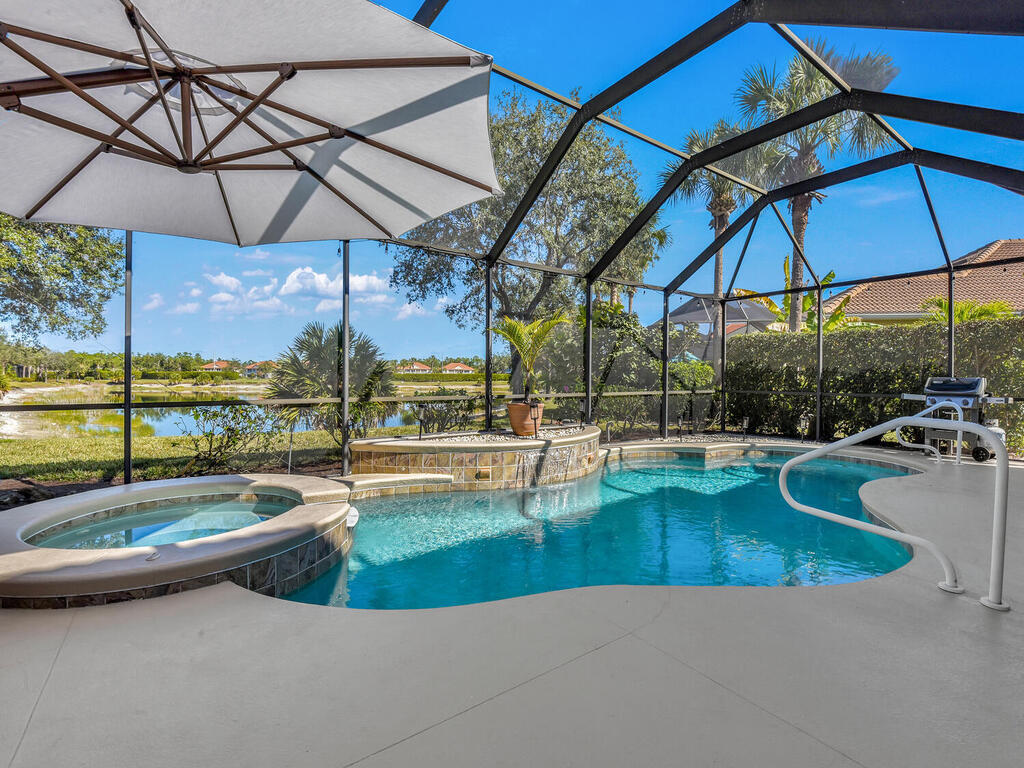 7851 Founders Circle Naples, FL 34104 - Photo 38 of 43 a view of a swimming pool with a patio