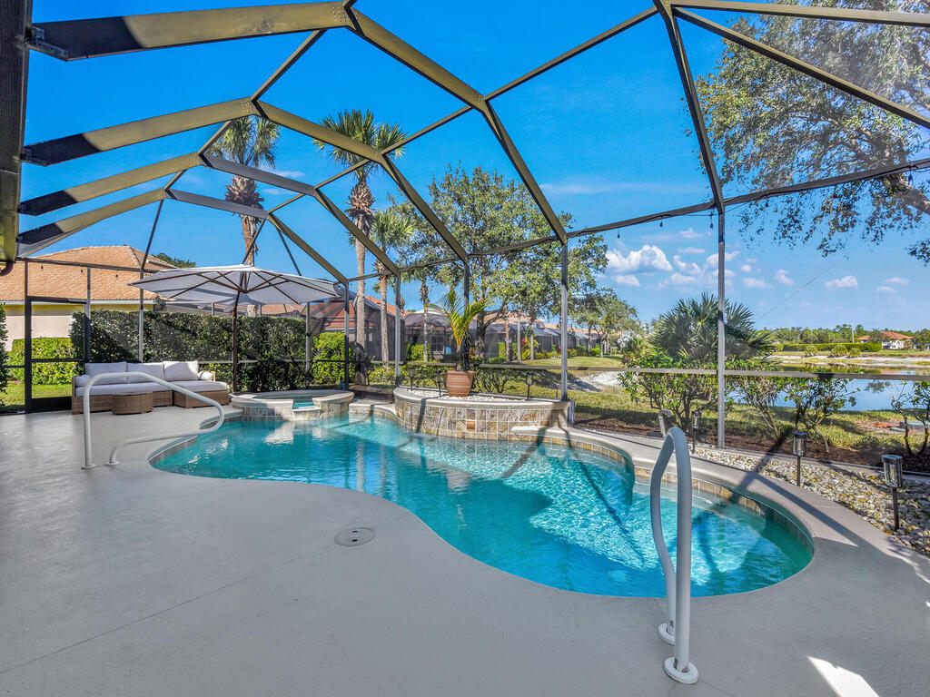 7851 Founders Circle Naples, FL 34104 - Photo 39 of 43 a view of a swimming pool with a patio
