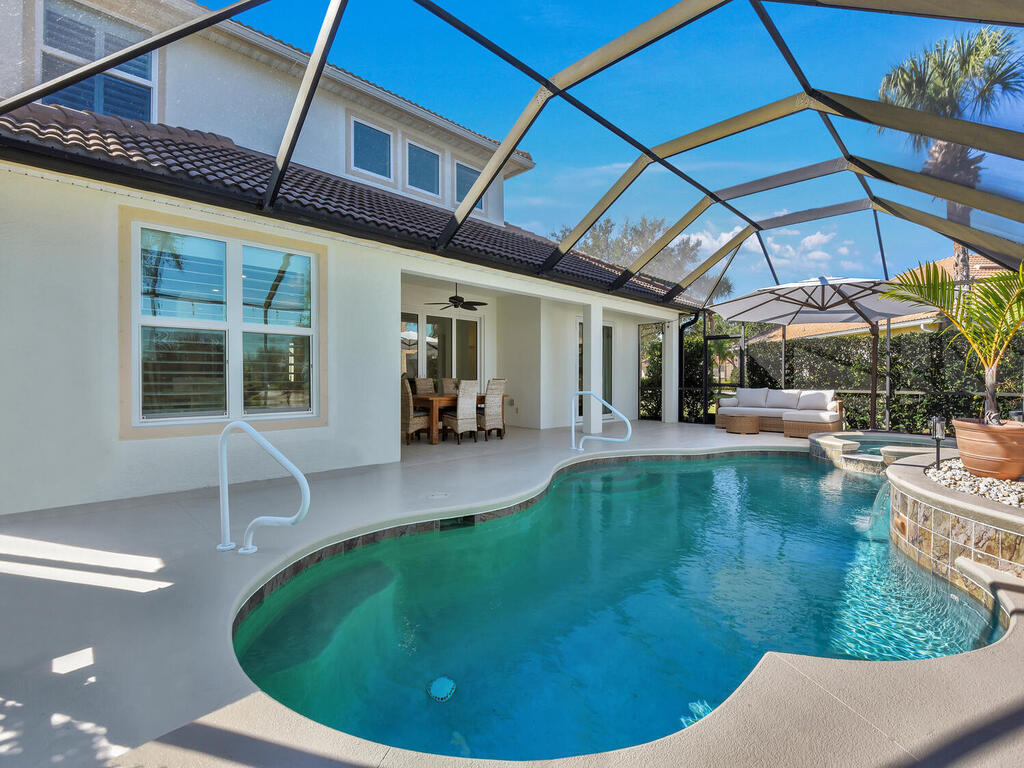 7851 Founders Circle Naples, FL 34104 - Photo 40 of 43 a view of a swimming pool with a patio