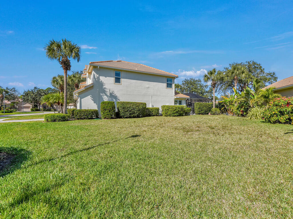 7851 Founders Circle Naples, FL 34104 - Photo 41 of 43 a front view of a house with a yard