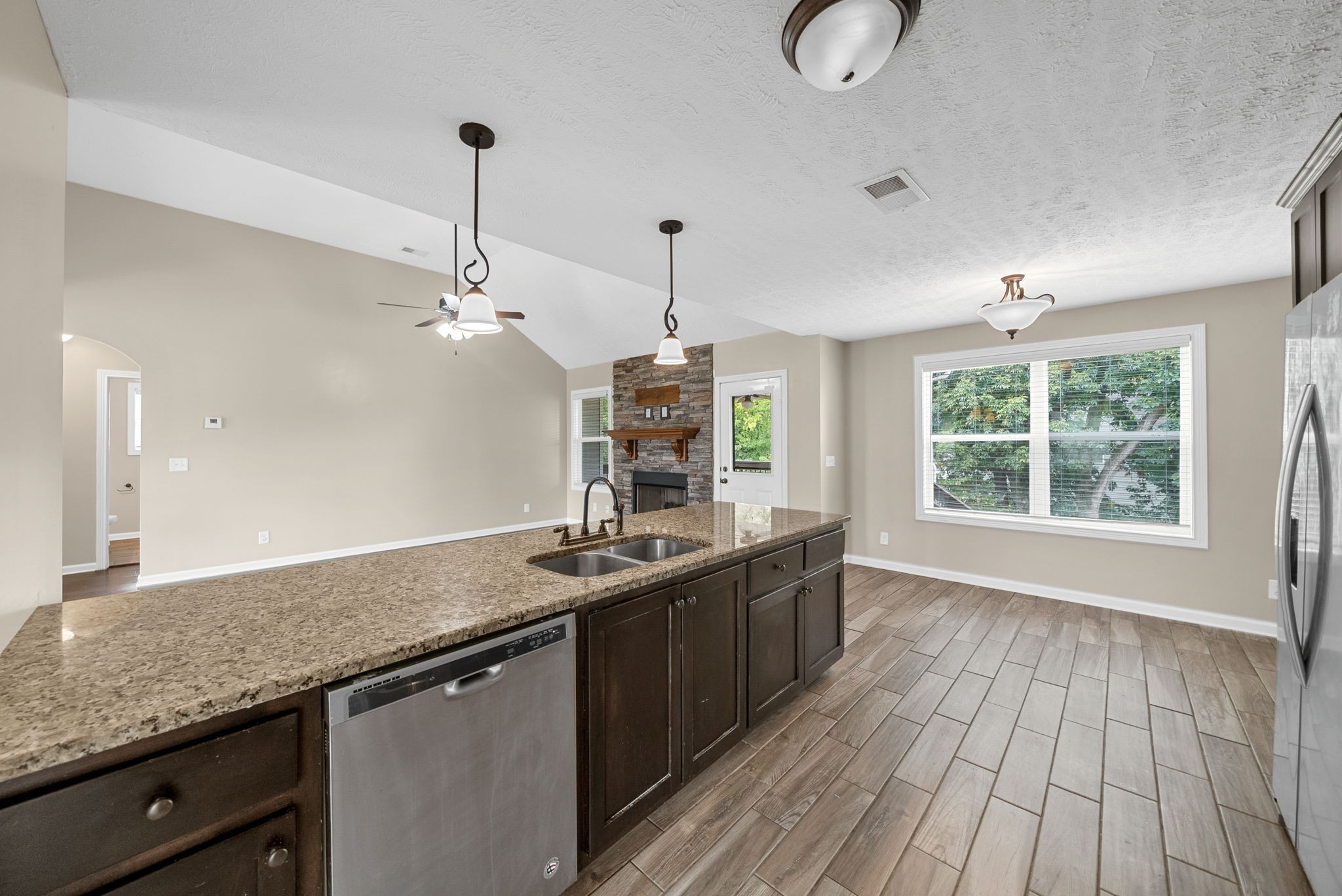 1227 Brigade Drive Clarksville, TN 37043 - Photo 12 of 39 a kitchen with sink window and wooden floor