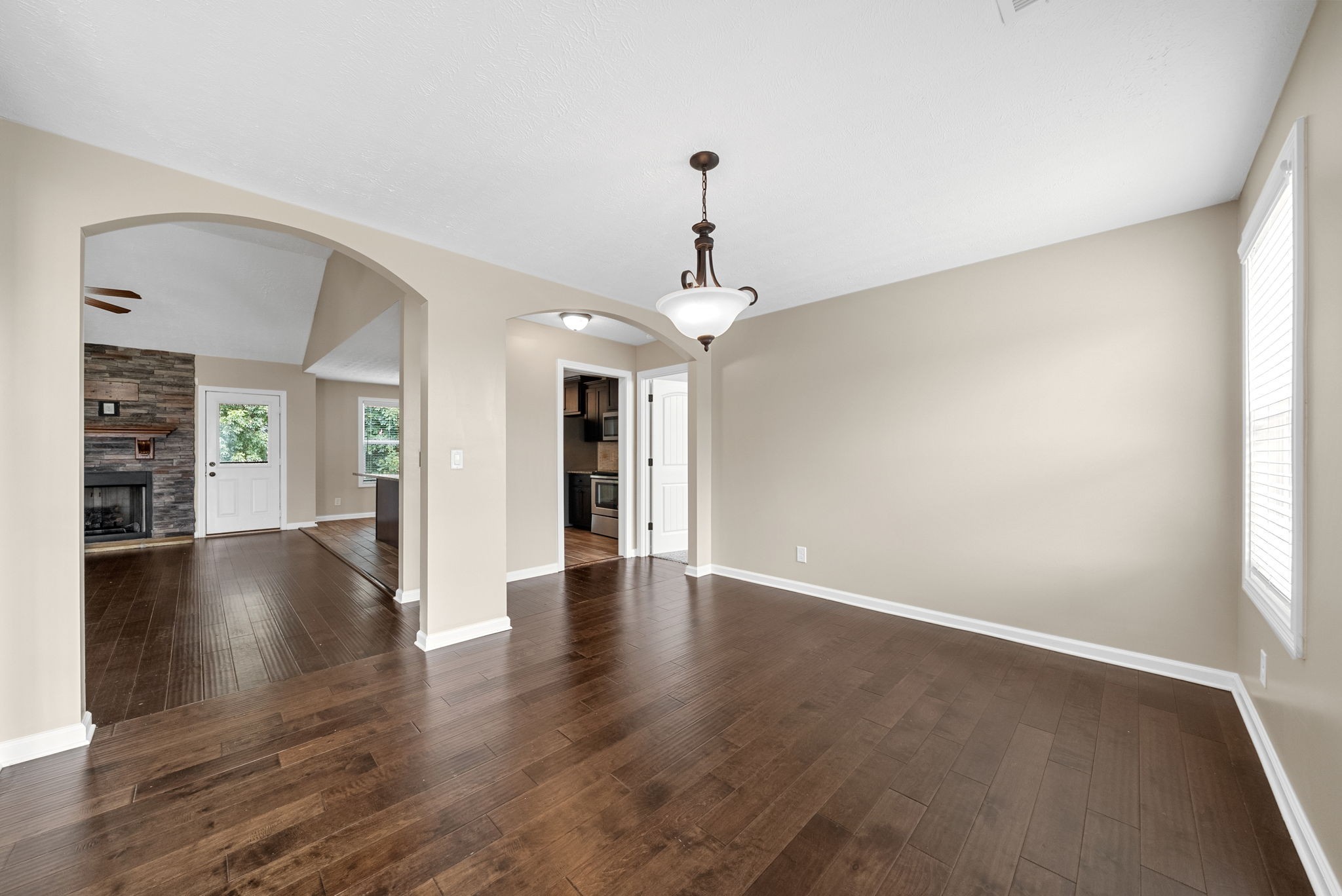 1227 Brigade Drive Clarksville, TN 37043 - Photo 14 of 39 a view of an empty room with wooden floor and a window